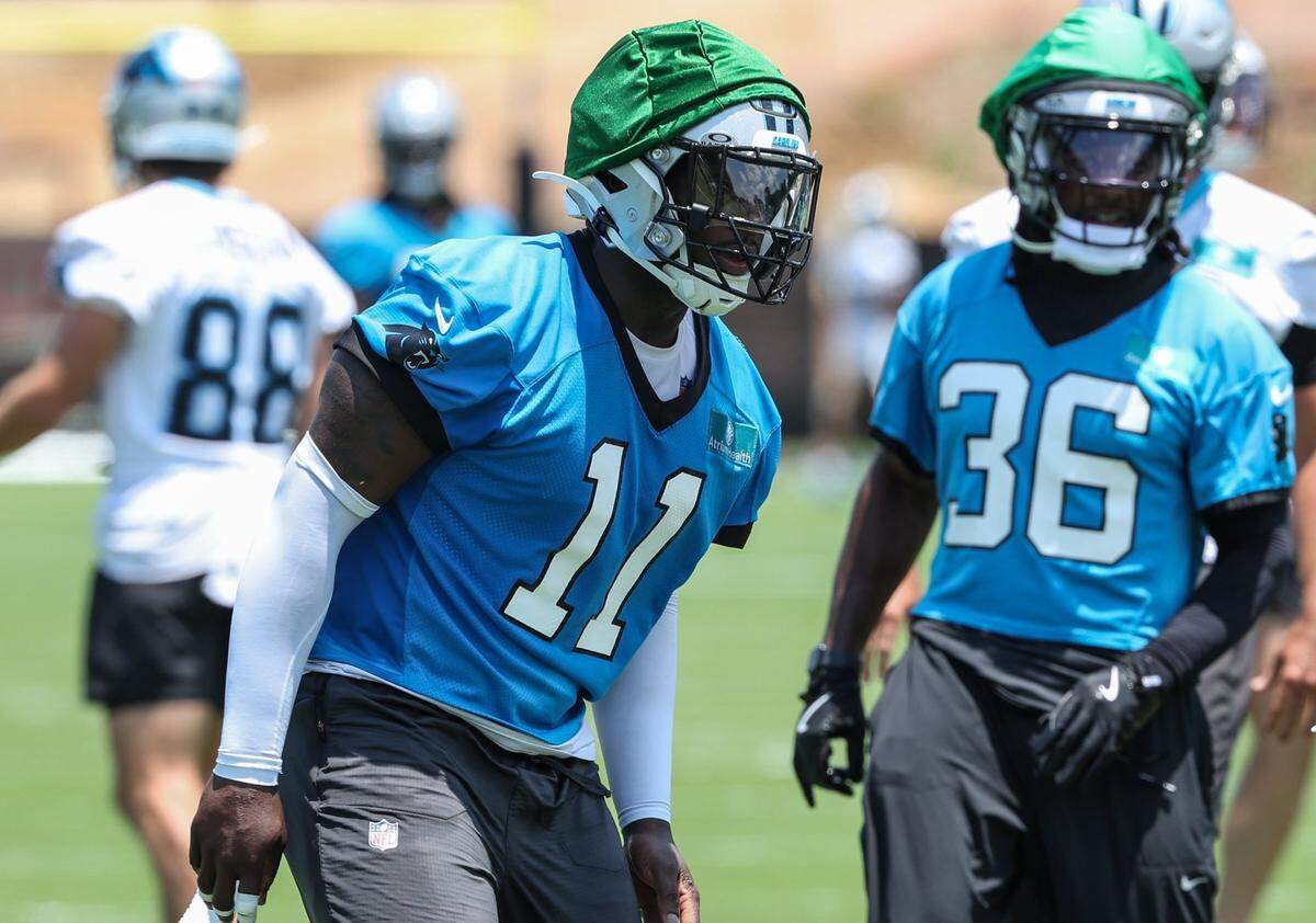 Panthers outside linebacker Nick Scourton, left, runs through a drill for special teams during the second day of minicamp in Charlotte, NC on Wednesday, June 11, 2025.