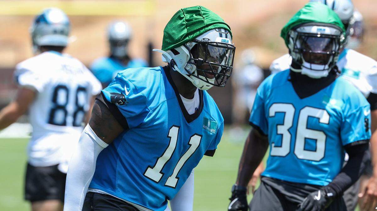 Panthers outside linebacker Nick Scourton, left, runs through a drill for special teams during the second day of minicamp in Charlotte, NC on Wednesday, June 11, 2025.