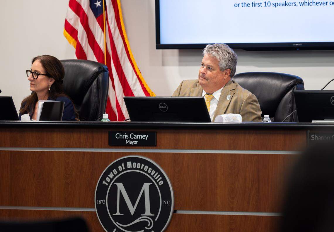 Mooresville Mayor Chris Carney listens during a council meeting in Mooresville on October 6, 2025.