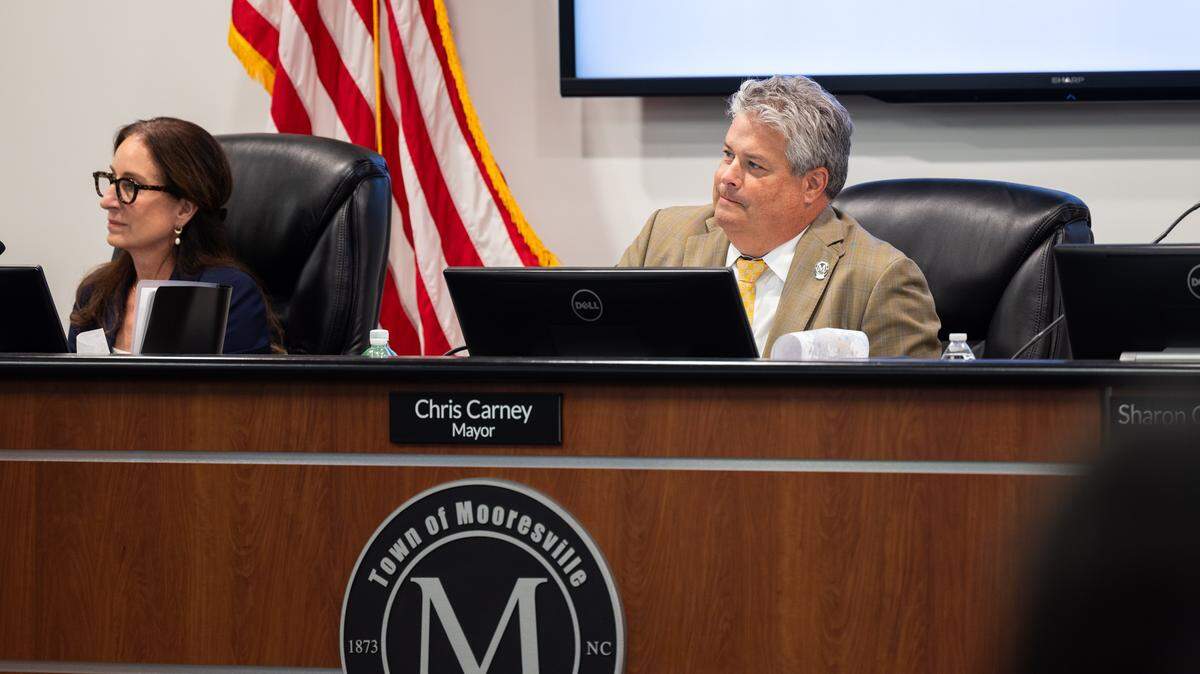 Mooresville Mayor Chris Carney listens during a town council meeting in Mooresville on October 6, 2025.