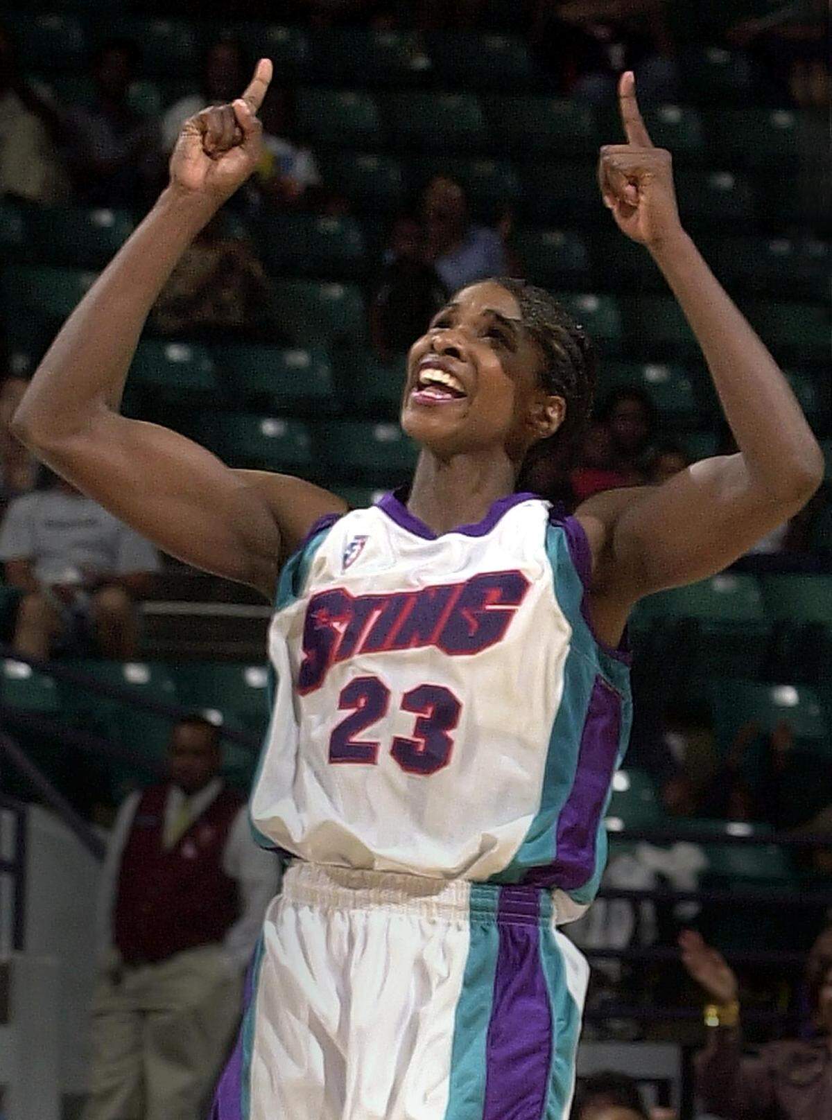08/16/01: Charlotte Sting player Charlotte Smith celebrated after hitting a three-pointer against the Cleveland Rockers.