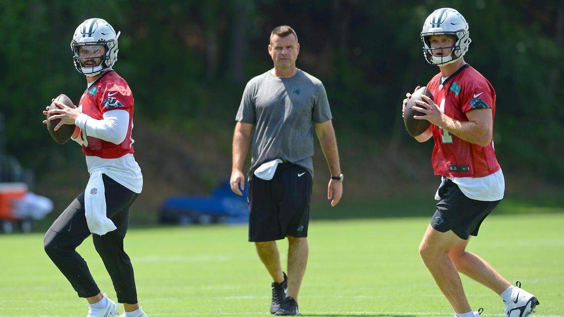 Carolina Panthers quarterbacks Baker Mayfield, left and Sam Darnold, right, drop back to pass to receivers during drills on Wednesday, July 27, 2022 at Wofford College in Spartanburg, SC.