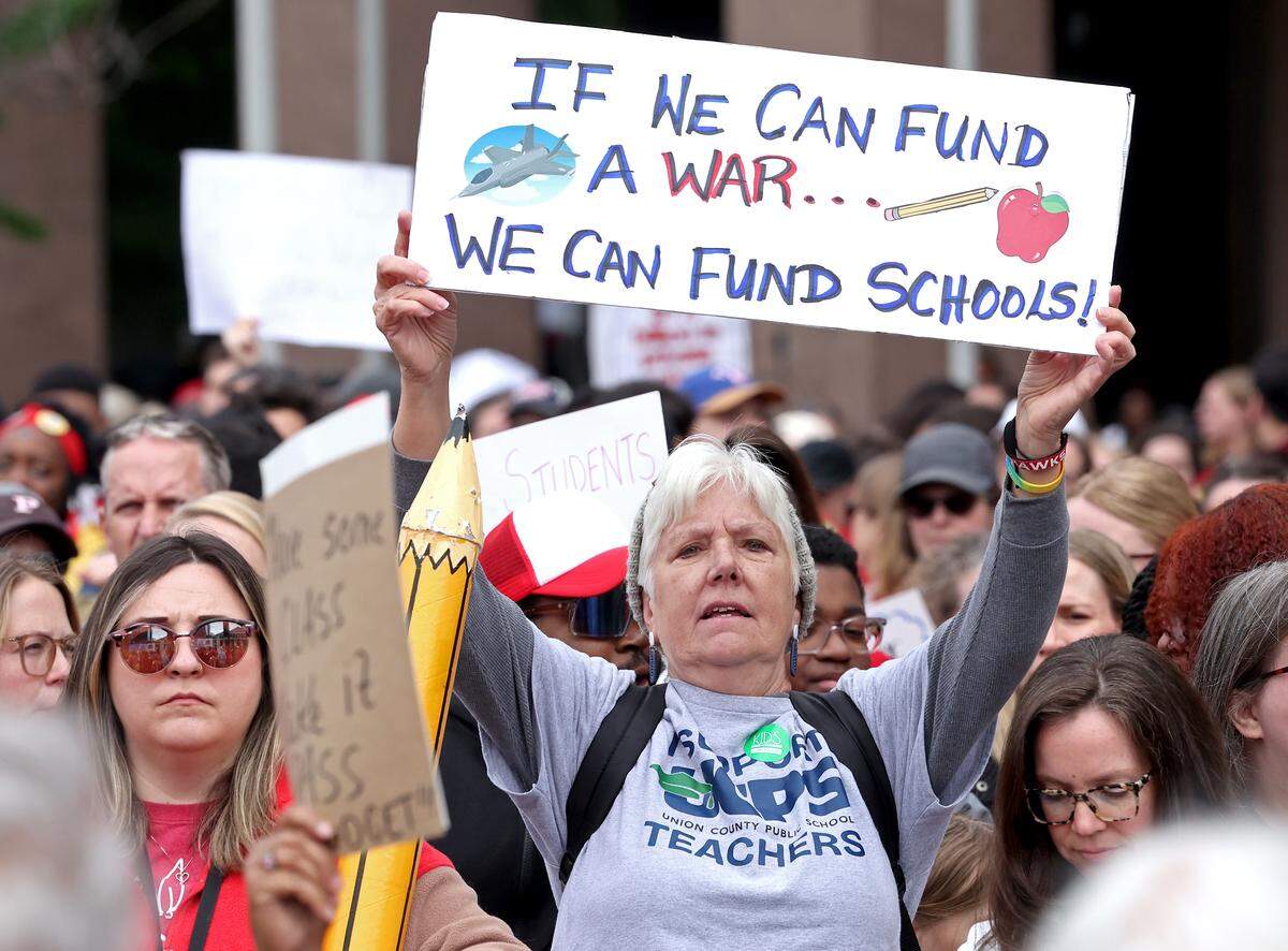 Signs, signs, signs were everywhere as teachers rallied at the Government Complex in Raleigh.