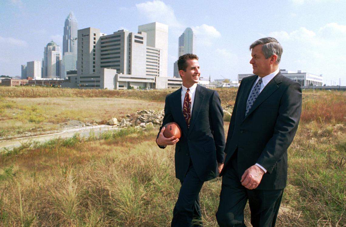 10/31/93 1A THE SITE: With the uptown skyline nearby, Mark and Jerry Richardson tour the land that will be home to Charlotte’s NFL stadium. While the Panthers’ stadium will be built by the Richardsons, the city, county and state are spending $57 million to buy and prepare the site.