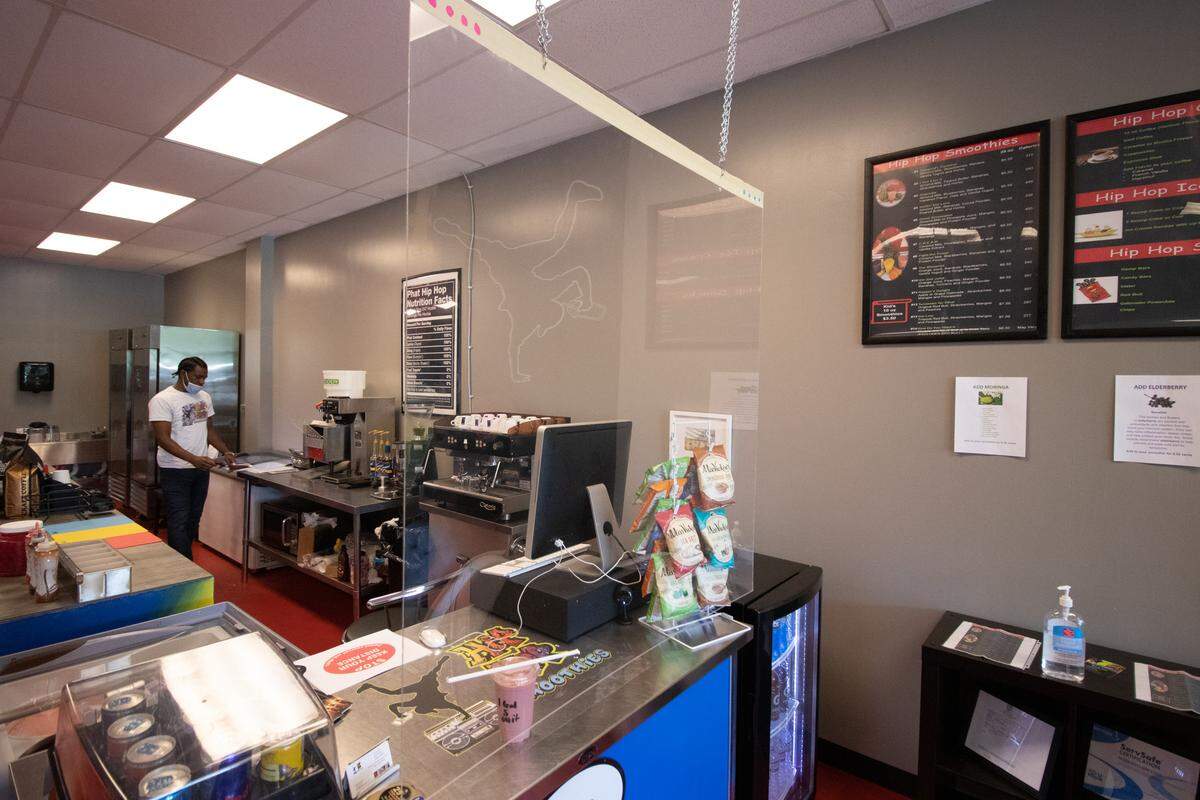 Protective glass will separate employees from customers during the COVID-19 pandemic at the new Hip Hop Smoothies.