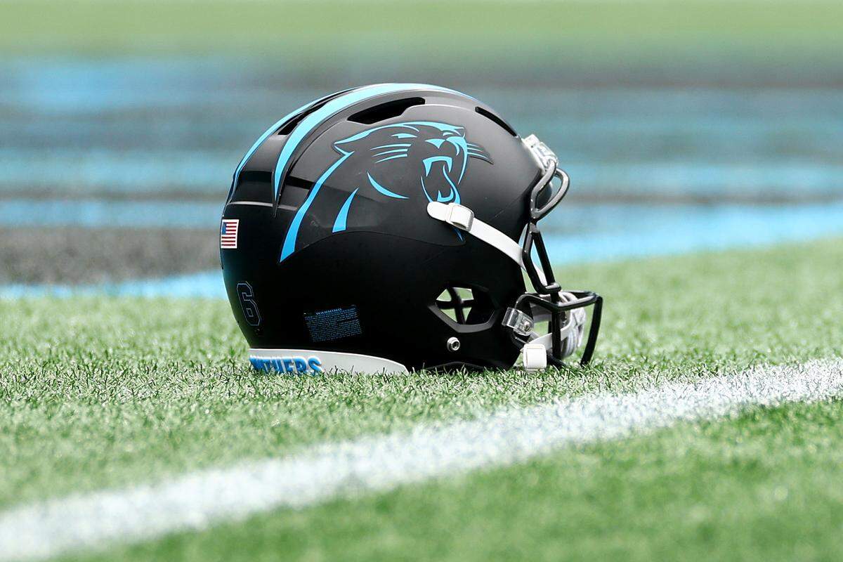 View of a Carolina Panthers helmet on the field prior to a 2025 game against the Dallas Cowboys at Bank of America Stadium.
