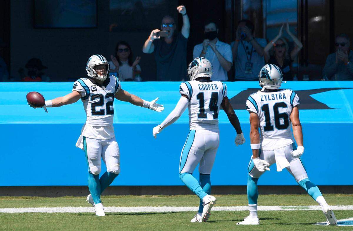 Carolina Panthers running back Christian McCaffrey (22) celebrates his touchdown with wide receiver Pharoh Cooper (14) and wide receiver Brandon Zylstra (16) agaisnt the the Las Vegas Raiders during the first half in their opening game of the 2020 NFL season at Bank of America Stadium on Sunday, September 13, 2020.