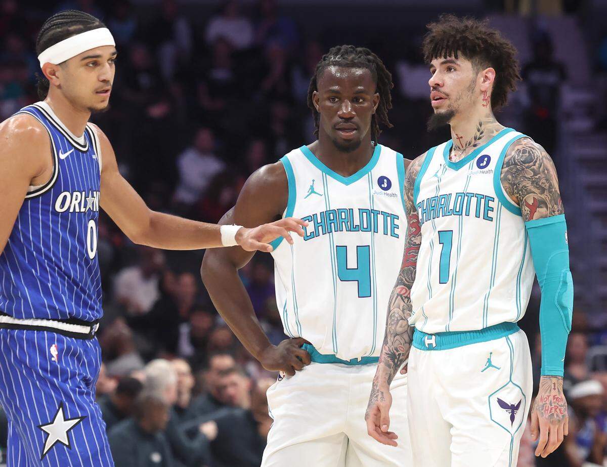 Charlotte Hornets rookie guard Sion James started alongside LaMelo Ball, right, in the team’s starting lineup against the Orlando Magic at Spectrum Center in Charlotte, NC on Thursday, October 30, 2025. At left is Orlando Magic guard Anthony Black. The Magic defeated the Hornets 123-107.