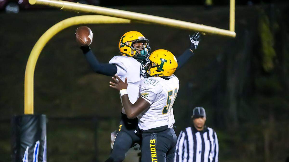 Independence players celebrate their victory over Lake Norman