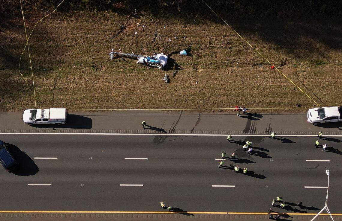 Drone image from the scene of a helicopter crash on the side of Interstate 77 South in Charlotte on Tuesday. Two people were confirmed dead in the crash, which involved a WBTV helicopter. 