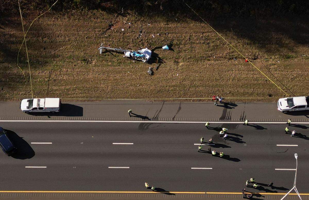 Drone image from the scene of a helicopter crash on the side of Interstate 77 South in Charlotte on Tuesday. Two people were confirmed dead in the crash, which involved a WBTV helicopter. 