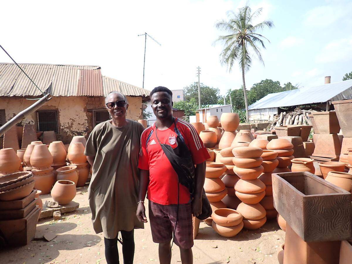 Charlotte artist Lydia Thompson with Ghanaian master potter Crispin Duah Atsu in his village in the Vume region.