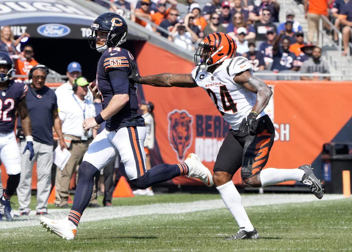 Sep 19, 2021; Chicago, Illinois, USA; Chicago Bears quarterback Andy Dalton (14) rushes the ball against the Cincinnati Bengals during the second quarter at Soldier Field. Mandatory Credit: Mike Dinovo-USA TODAY Sports