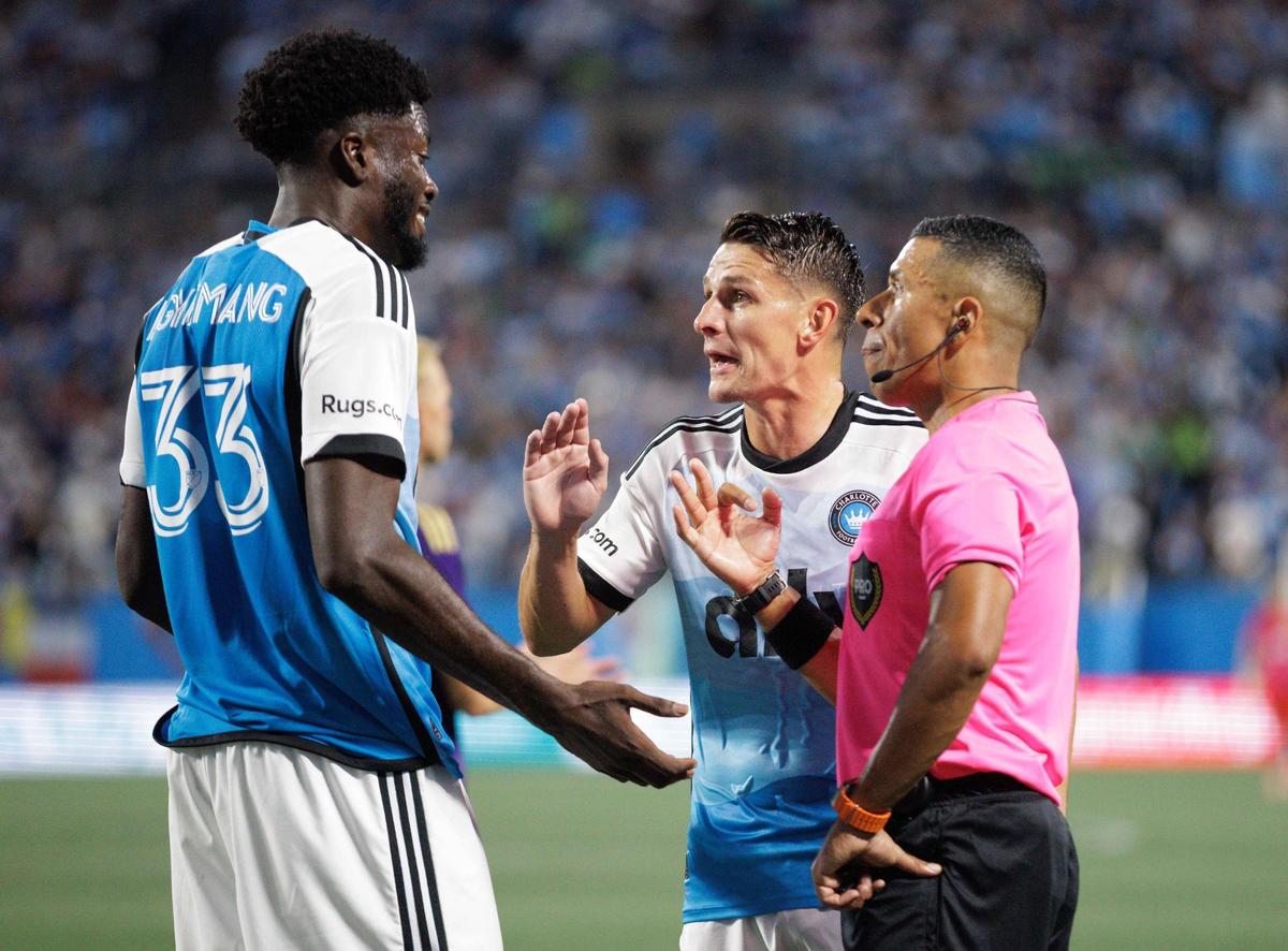 Charlotte FC’s Ashley Westwood (center) and Patrick Agyemang (33) discuss a foul during late 1st half action. Charlotte FC would host Orlando City in Game 2 of the MLS Playoffs Friday November 1, 2024.