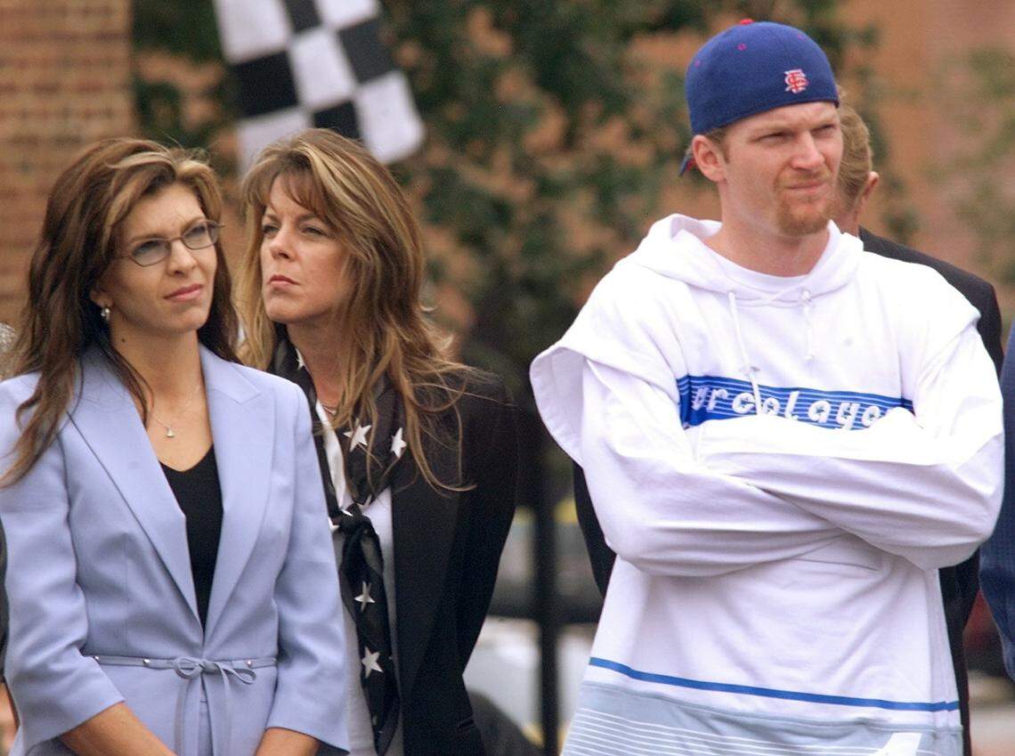 Teresa Earnhardt (left) and Dale Earnhardt, Jr., right, the widow and son, respectively, of Dale Earnhardt, Sr., attend the unveiling of a statue commemorating the late NASCAR driver in downtown Kannapolis, N.C., on Oct. 14, 2002. The nine-foot bronze statue was created by Arizona sculptor Clyde Ross Morgan in the aftermath of Earnhardt’s death in 2001.