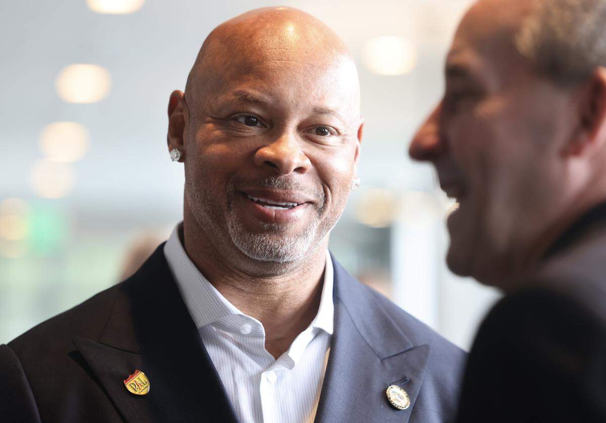Laveraunes Coles, former NFL player, speaks with a guest at the Hood-Hargett Breakfast Club at the Hyatt Centric South Park Thursday, April 30, 2026 in Charlotte.