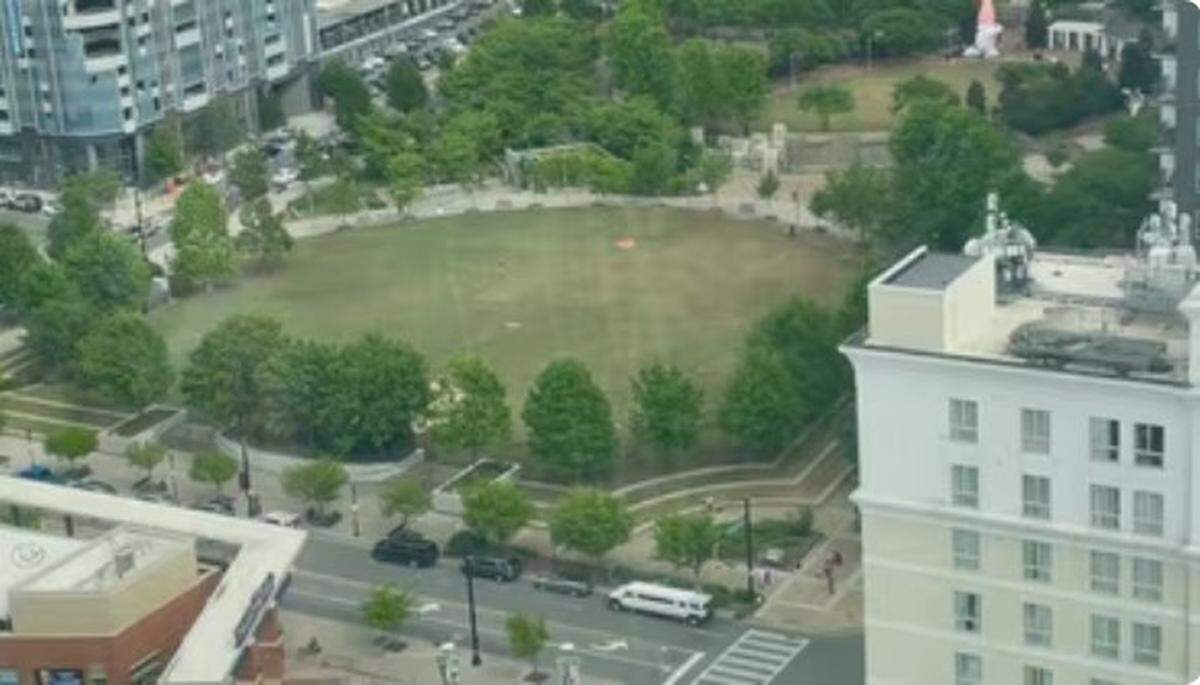 A view of Romare Bearden Park in the aftermath of people scattering in the wake of a shooting there Sunday afternoon that left two people with life-threatening injuries.