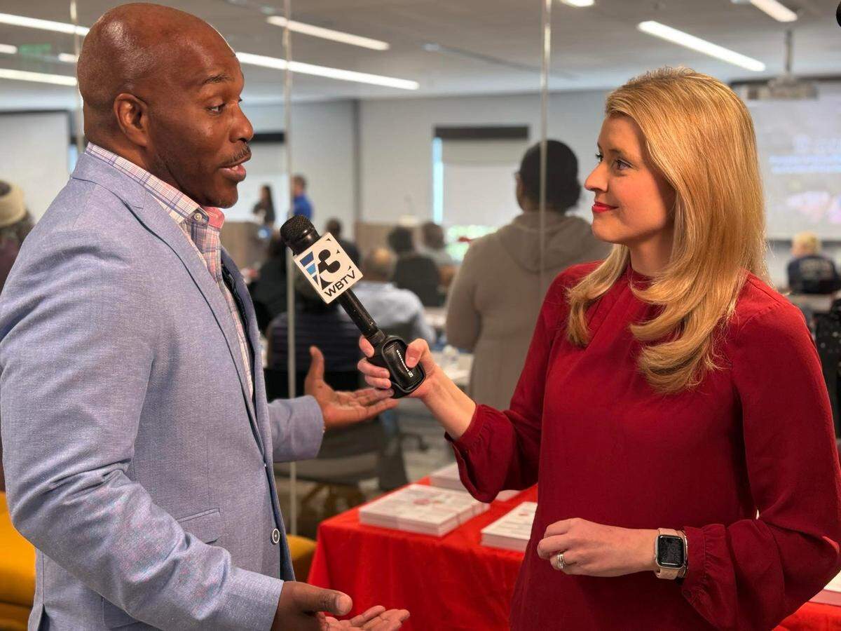 Mary King interviews sudden cardiac arrest survivor Johnnie Davis in February for a program WBTV aired as part of a partnership with the American Heart Association.