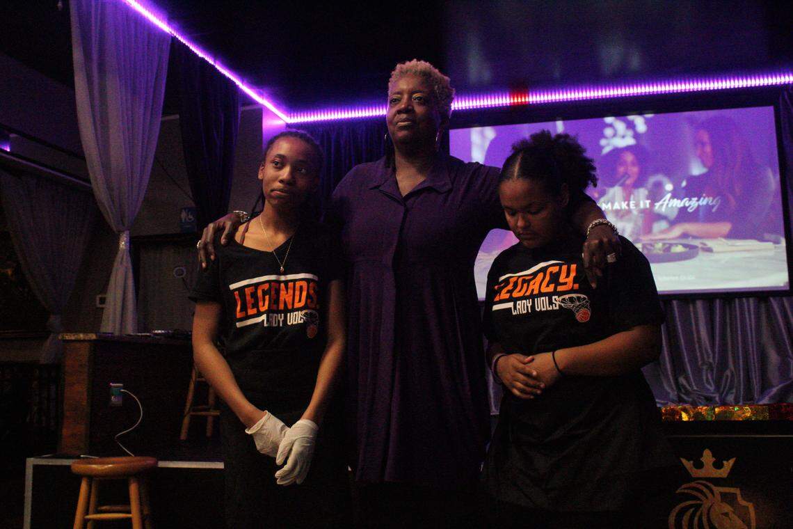 Cheryl Littlejohn with Iysis and Alazjan, two of Smith’s teenage employees, during the “Restaurant Impossible” episode premier party.