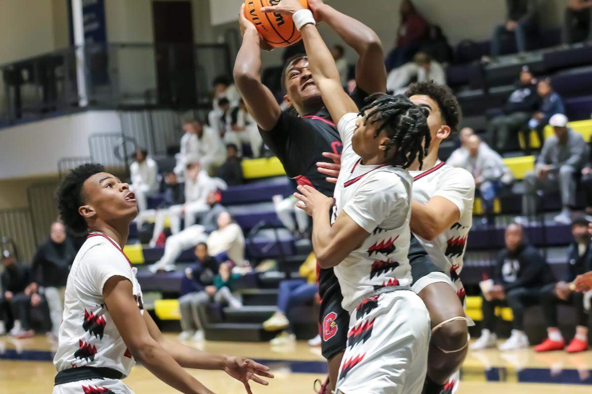 Butler defies gravity for a clutch shot, guarded intensely by the opposing defense at the Carmel Christian MLK showcase presented by Phenom Hoops at Carmel Christian high school on January 18th, 2025 in Charlotte, NC