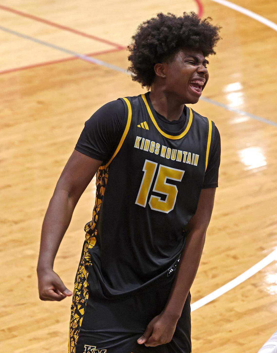 Kings Mountain’s Micaiah Daniel turns to the bench to celebrate the team’s 68-61 victory over Charlotte Catholic in the NCHSAA 6A boy’s regional championship game on Wednesday, March 4, 2026 at Lenoir-Rhyne University in Hickory, NC. 