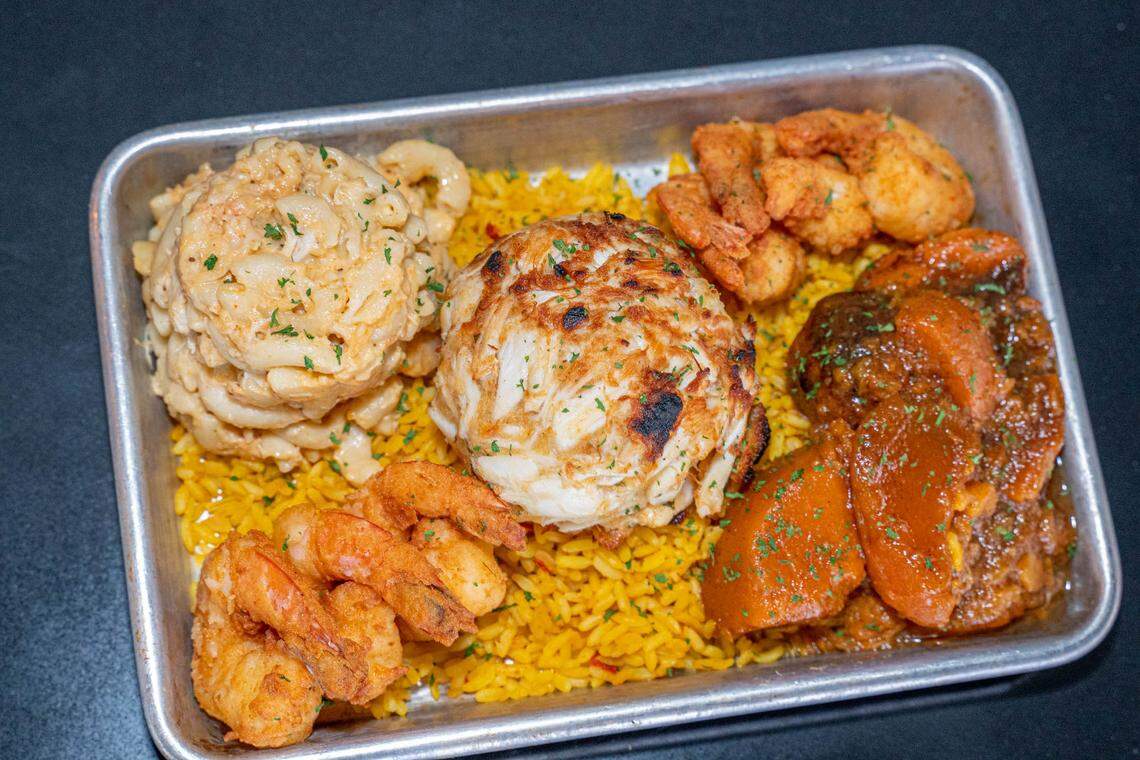 Lulu’s crab cake and shrimp combo with yams, seafood mac and rice.