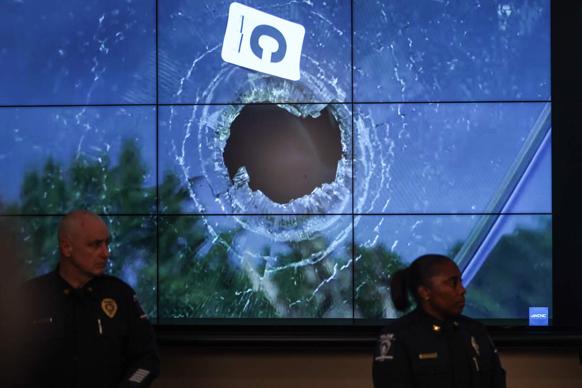 A crime scene photo showing glass pierced by one of the many bullets fired during a press conference on Friday, Oct. 2, 2026, to provide additional information about the arrests of four teenagers in the fatal shooting of a 4-year-old boy in Charlotte on Sept. 20.