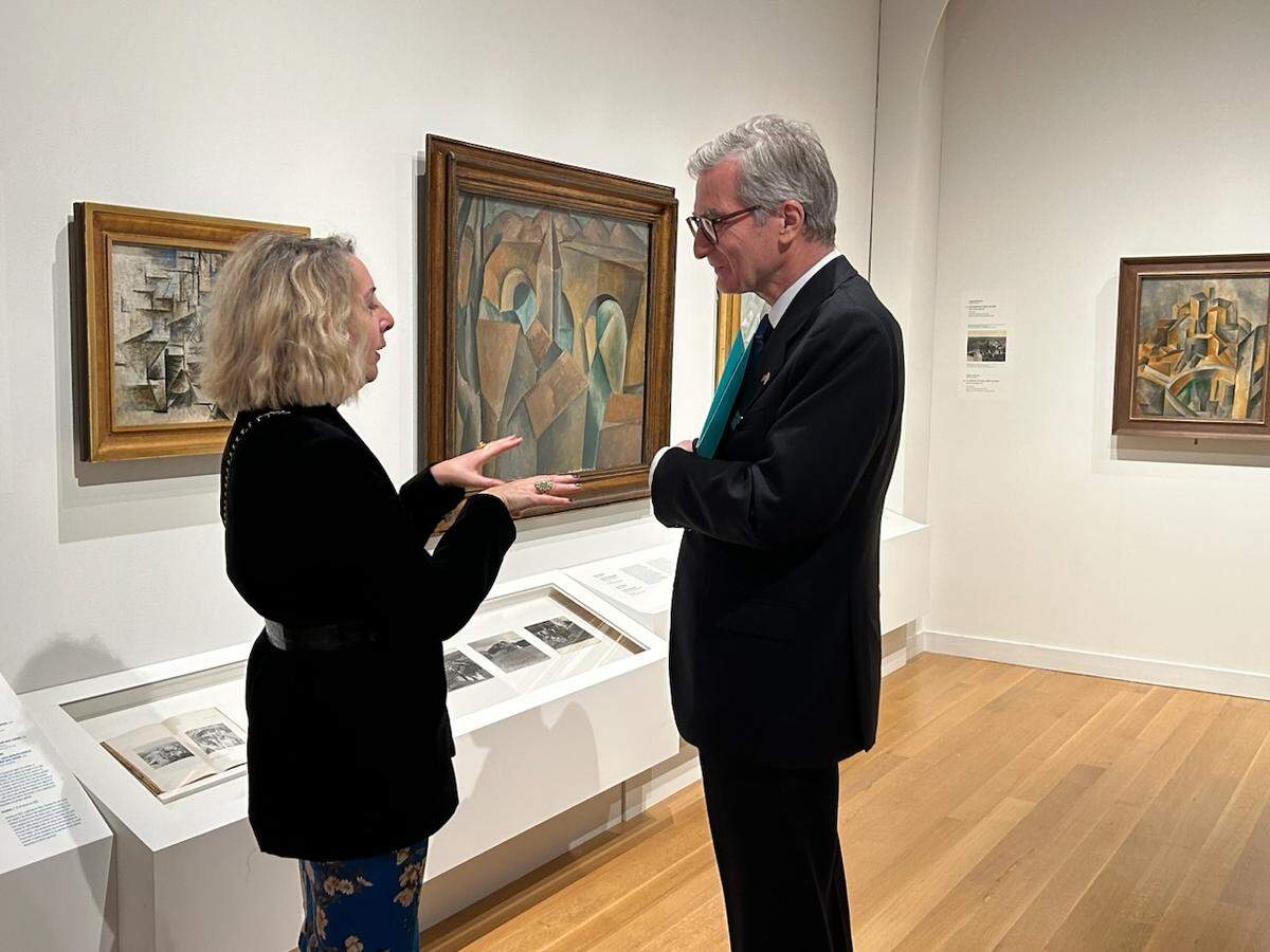 American Federation of Arts guest curator Laurence Madeline, left, talks Thursday with Santiago Cabanas, the Spanish ambassador to the US, during media preview night of “Picasso Landscapes: Out of Bonds” opening Feb. 11 at Mint Museum Uptown.
