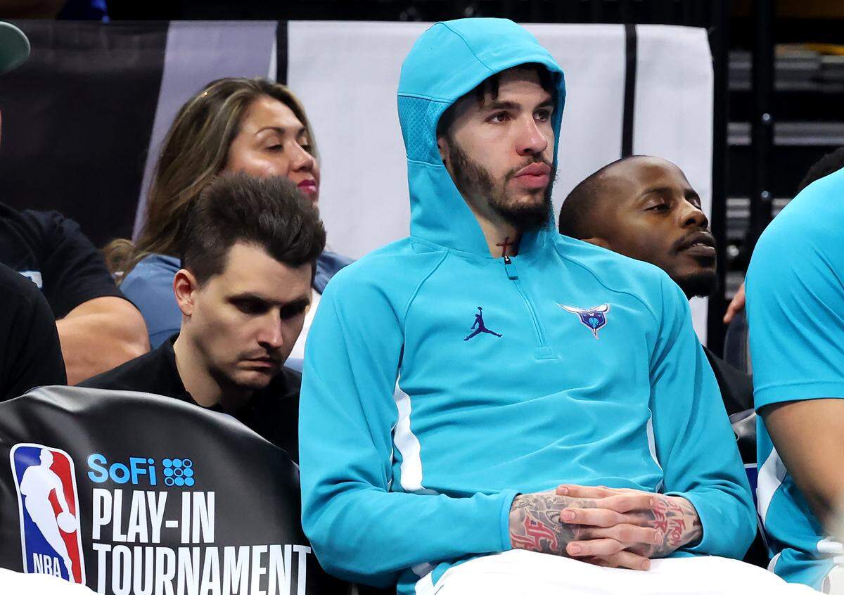 Charlotte Hornets guard LaMelo Ball sits on the bench during the final moments against the Orlando Magic at Kia Center in Orlando on April 17. The Magic defeated the Hornets 121-90.