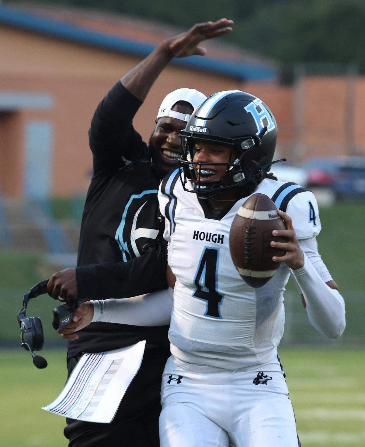 Hough Huskies quarterback Trey Blakeney celebrates his touchdown run against the North Meck Vikings during first quarter action on Thursday, September 14, 2023 at North Meck High School.