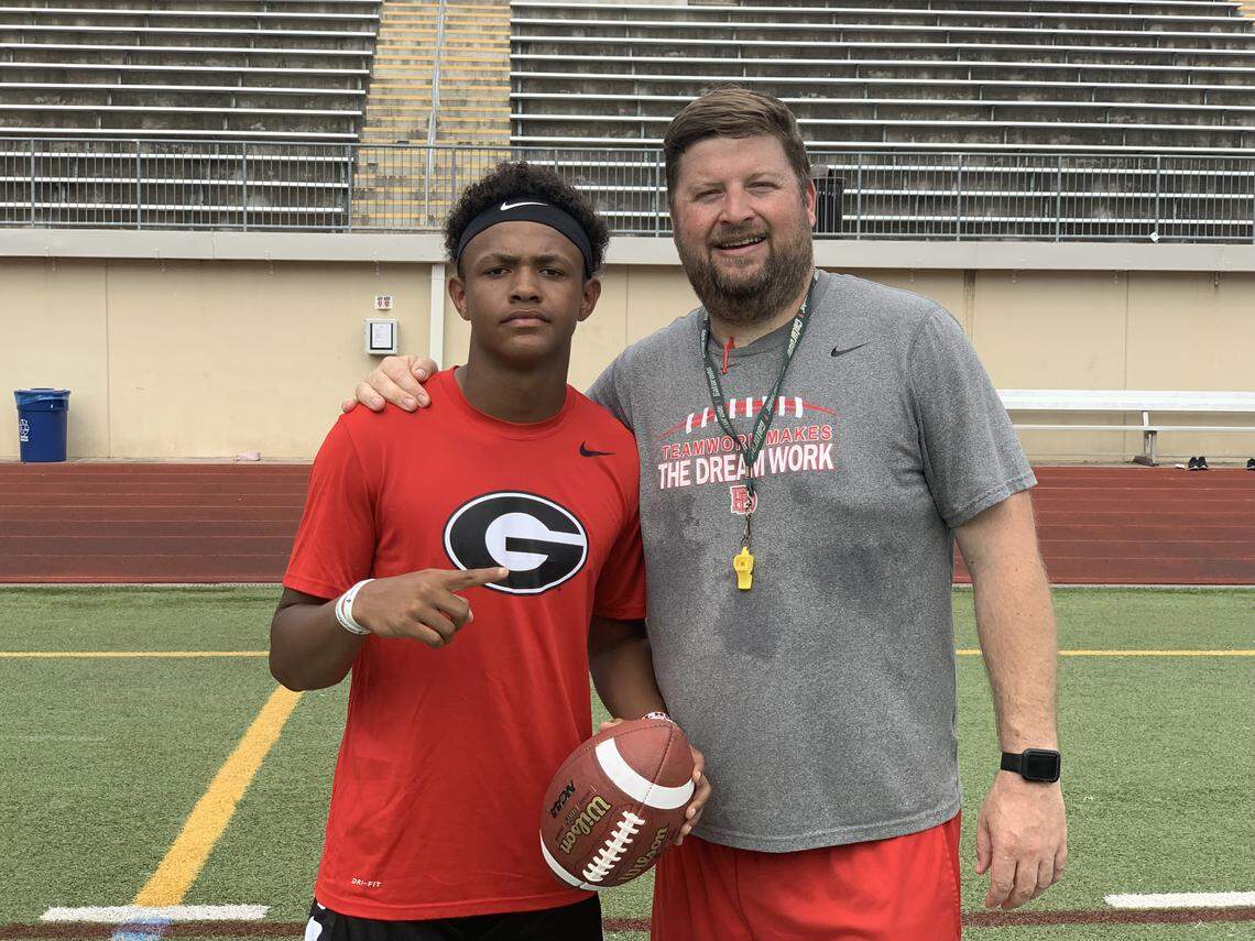 Providence Day quarterback Jadyn Davis (left) and Chargers coach Adam Hastings