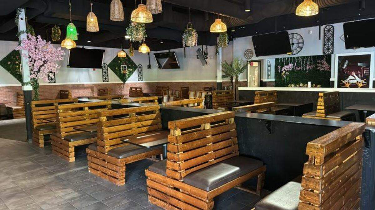 Savor Restaurant and Bar — opening Saturday, May 11 — mixes natural materials and bright colors throughout the space.