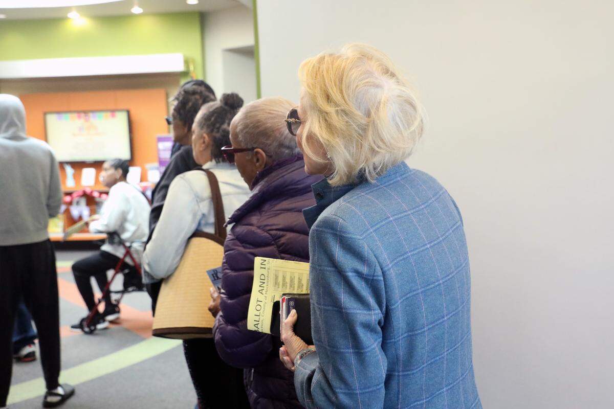 Early voters wait to cast their ballot inside the polling place at the Allegra Westbrooks Regional Library in Charlotte, N.C. on October 17, 2024.