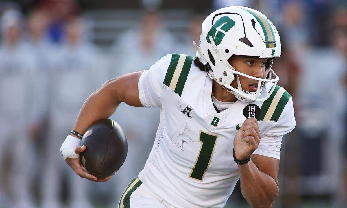 Oct 19, 2024; Annapolis, Maryland, USA; Charlotte 49ers quarterback Max Brown (1) runs with the ball during the first half against the Navy Midshipmen at Navy-Marine Corps Memorial Stadium.