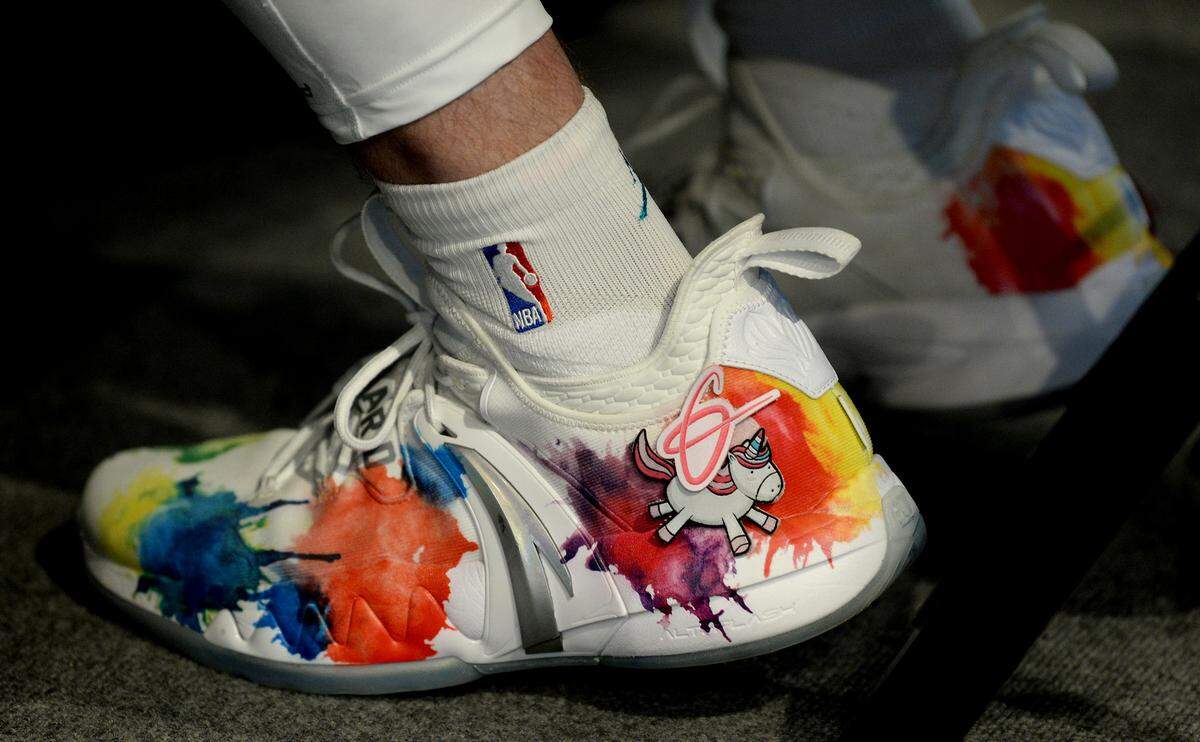 Charlotte Hornets forward Gordon Hayward’s shoes feature splashes of paint and a unicorn on Monday at Spectrum Center/