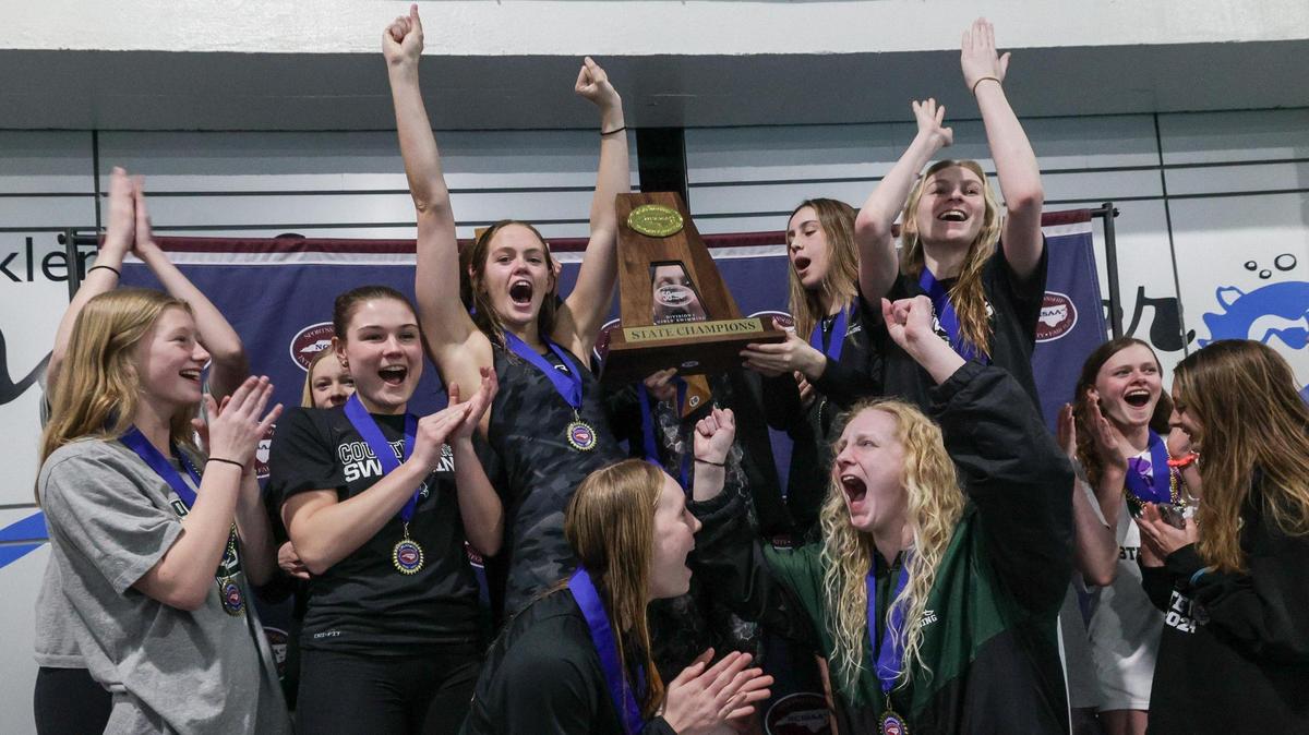 The girls of Charlotte Country Day celebrate winning the NCISSA state championship at Mecklenburg County Aquatic Center in Charlotte, NC on Tuesday, February 13, 2024.