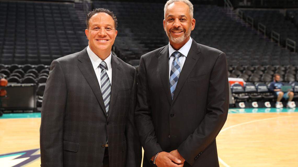 Bally Sports Southeast TV play-by-play man Eric Collins stands next to partner Dell Curry in this file photo.