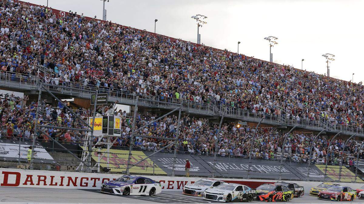 After an hour-long delay because of lightning in the area, the Southern 500 field is led to the start by pole-sitter Denny Hamlin (11).