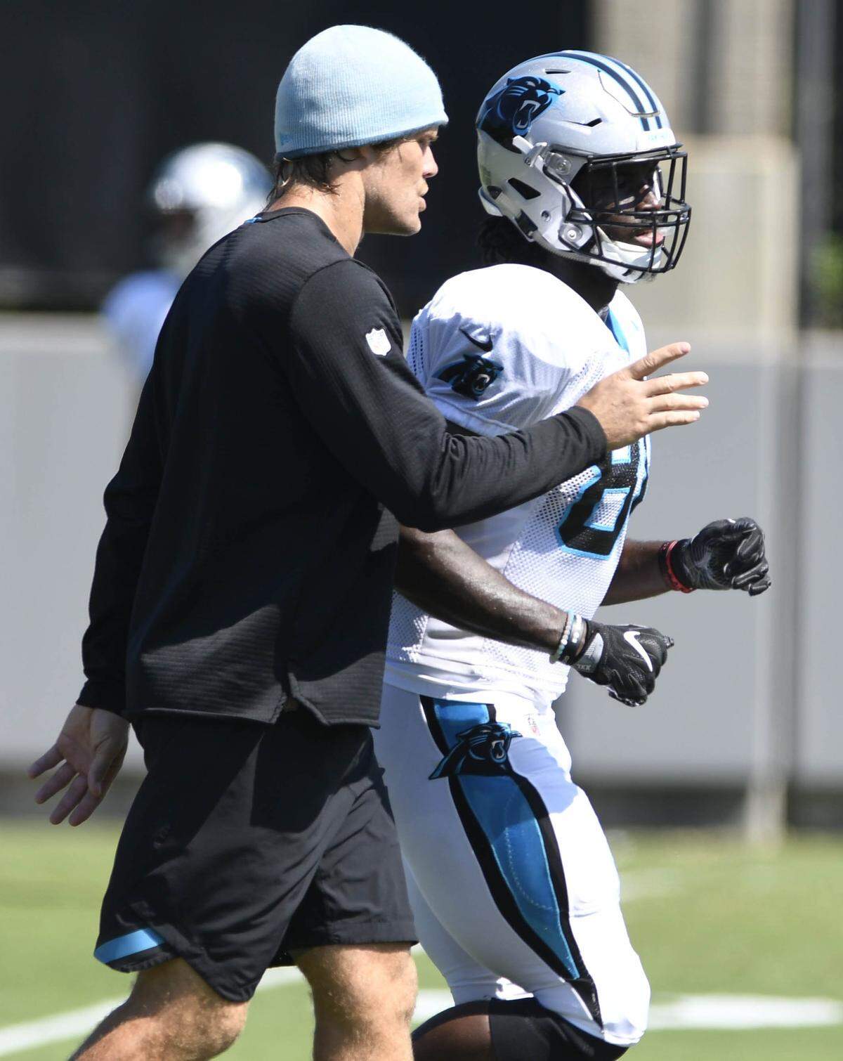 Studying and learning from Greg Olsen, left, over the past several weeks helped prepare Ian Thomas for his second stint as the Panthers’ starting tight end.