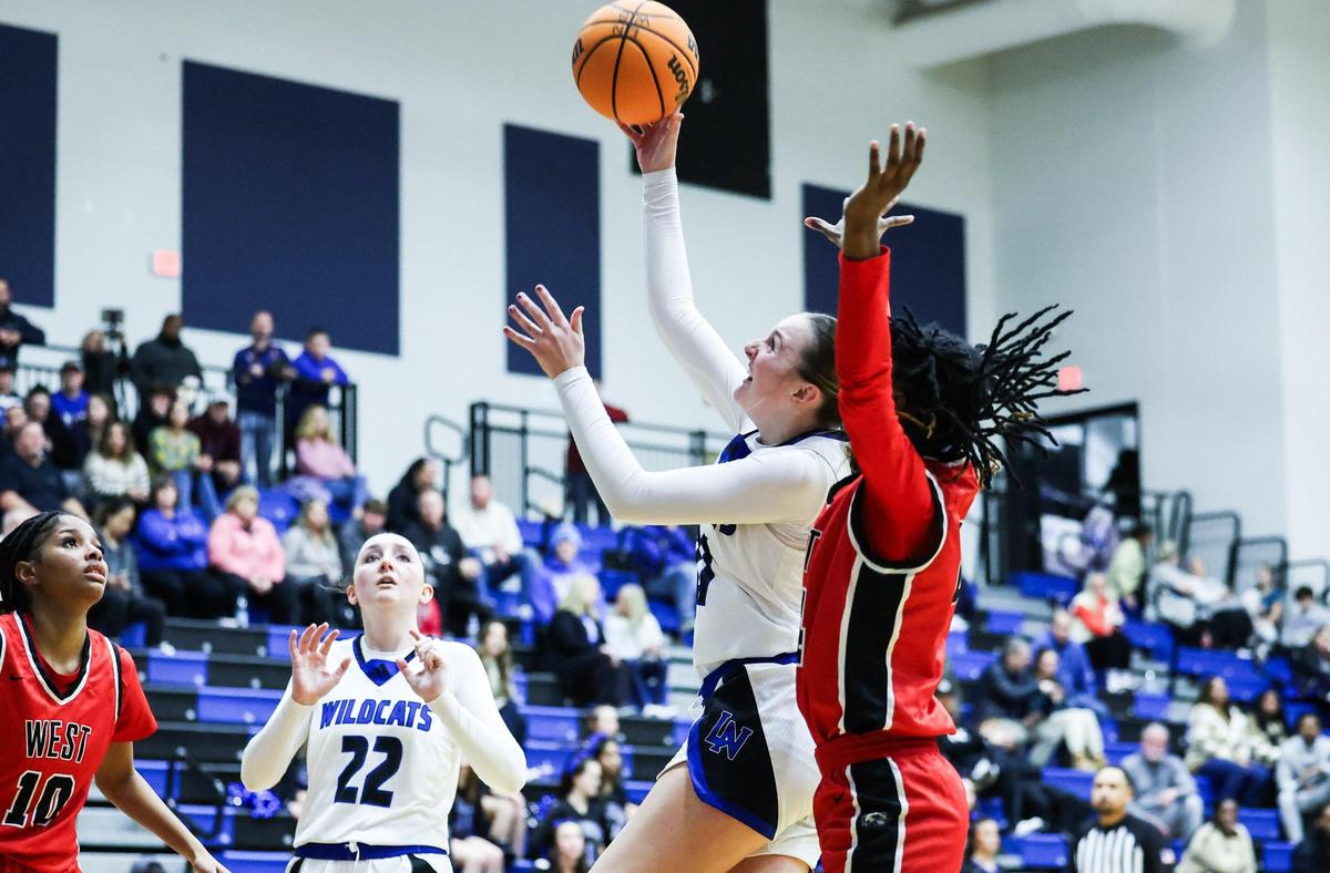 Lake Norman Wildcats Alexis Shehan shoots against the West Cabarrus Wolverines at Lake Norman High School in Mooresville, N.C., on Tuesday, January 7, 2025.