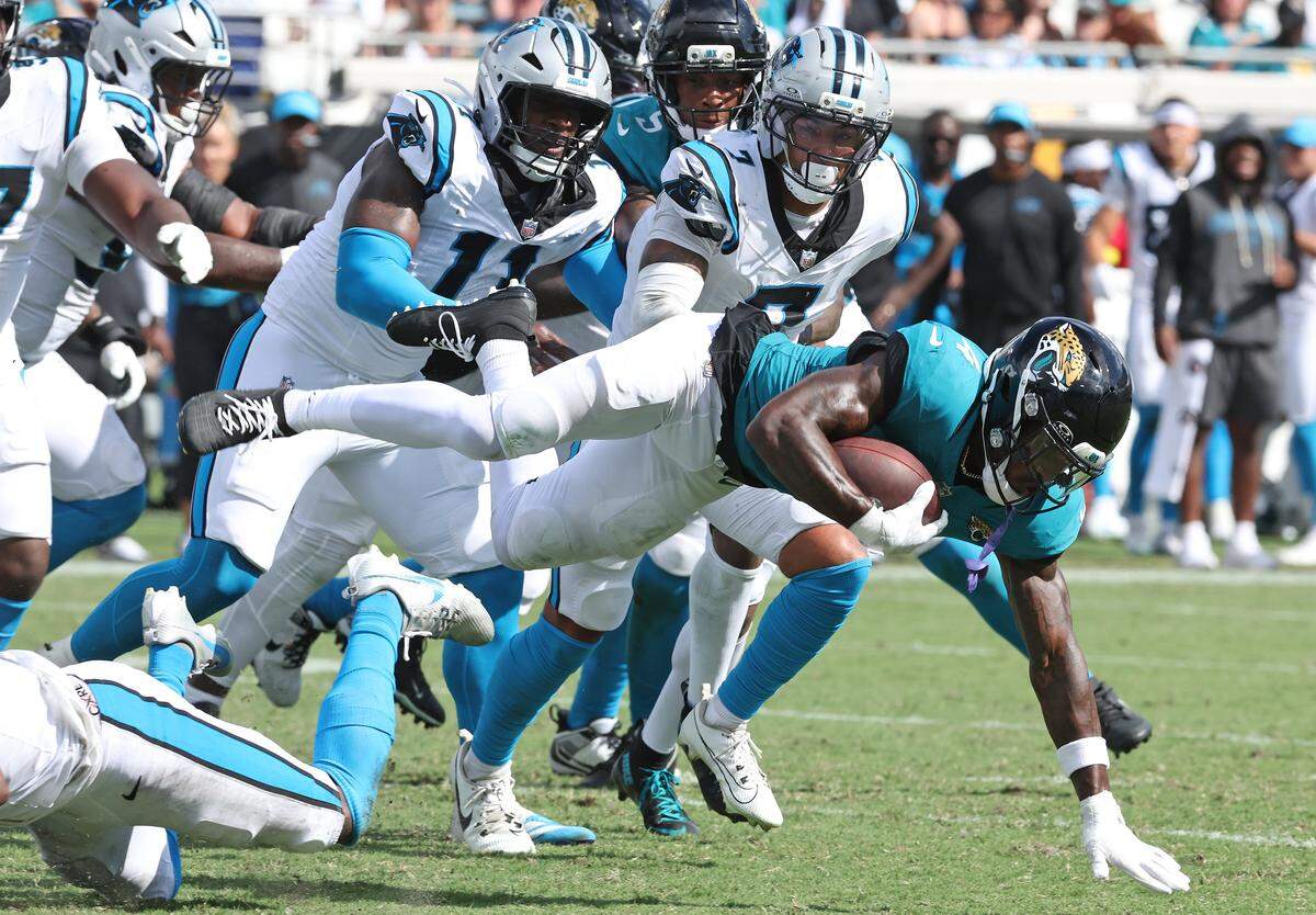 Carolina Panthers safety Tre’Von Moehrig, center looks to assist on a tackle of Jacksonville Jaguars running back Tank Bigsby during action on Sunday, September 7, 2025, at Everbank Stadium in Jacksonville, Florida. The Jaguars defeated the Panthers 26-10.
