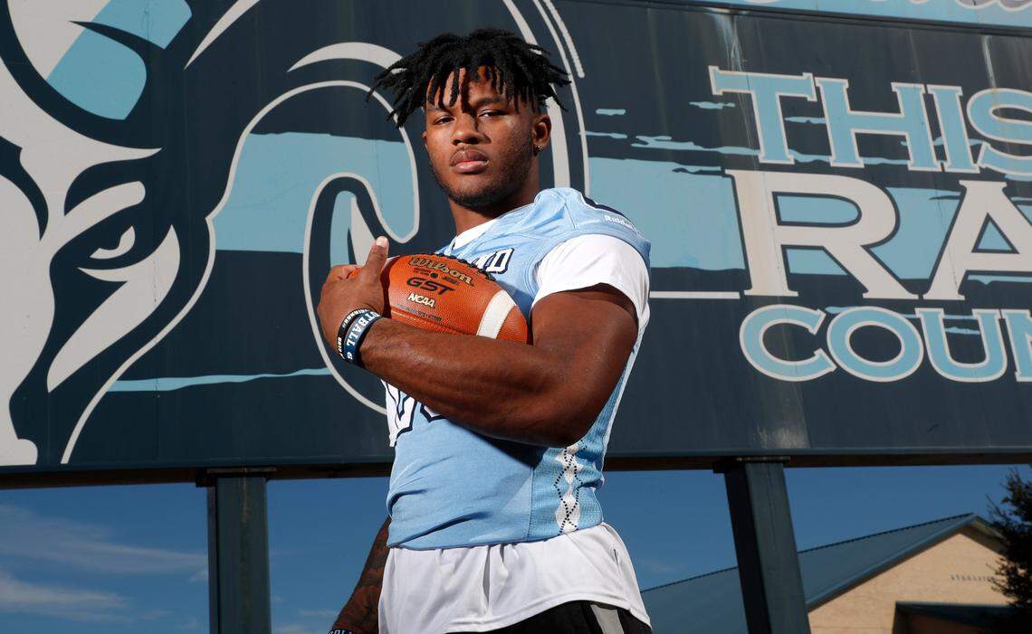 Omarion Hampton, running back at Cleveland High School in Clayton, N.C., poses outside the school on Wednesday, December 1, 2021.
