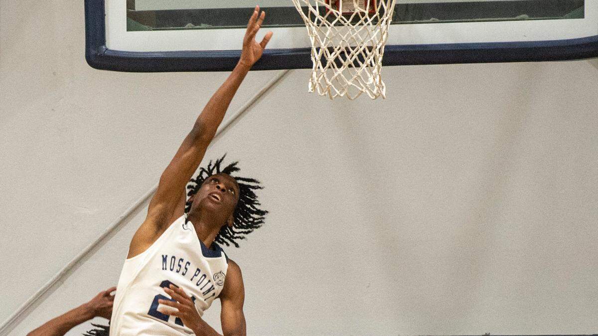 Moss Point forward Kedrick Osby scores during a game against Biloxi at Moss Point High School in Moss Point on Tuesday, Dec. 21, 2021.