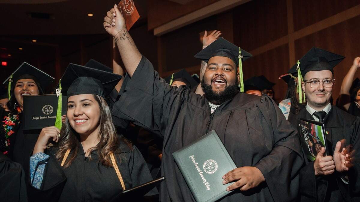 Durham Technical Community College students celebrate graduation in May 2023.