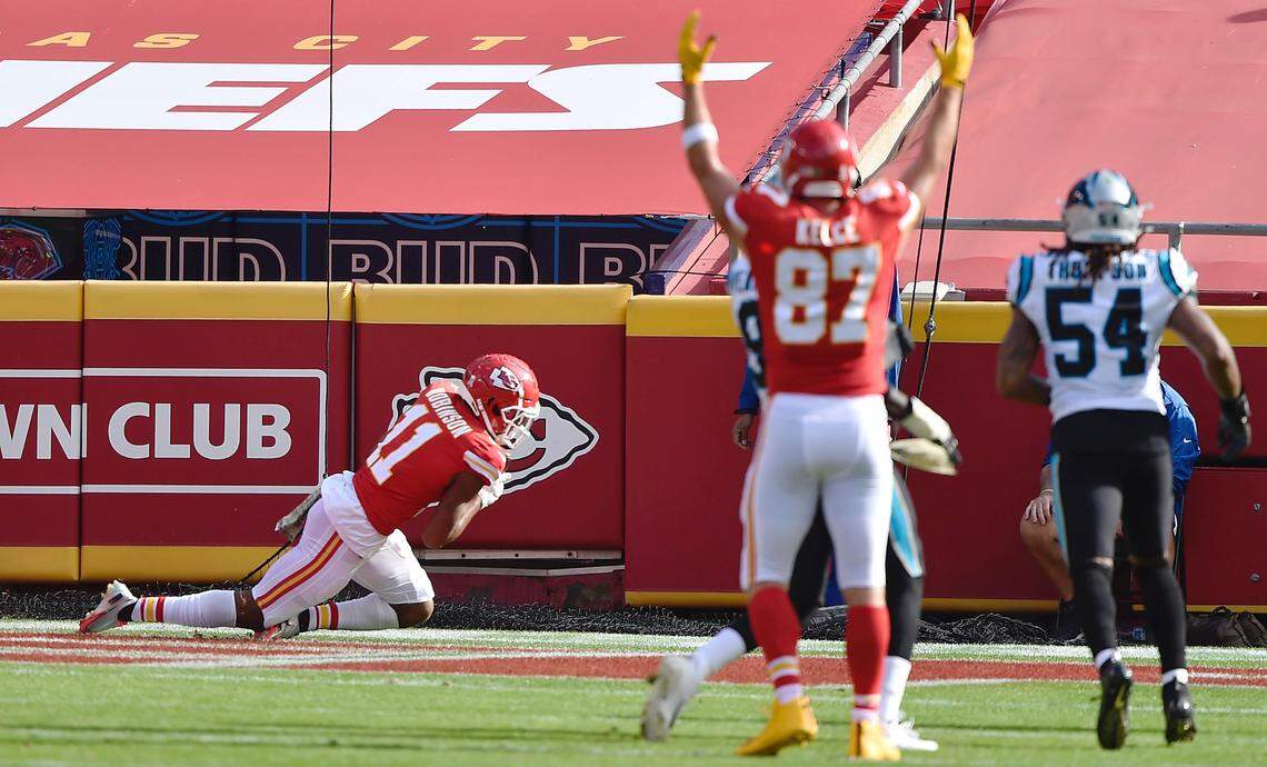 Kansas City Chiefs tight end Travis Kelce signals touchdown as wide receiver Demarcus Robinson comes down with a touchdown catch in the second quarter agains the Carolina Panthers Sunday, November 8, 2020, at Arrowhead Stadium in Kansas City, Missouri.