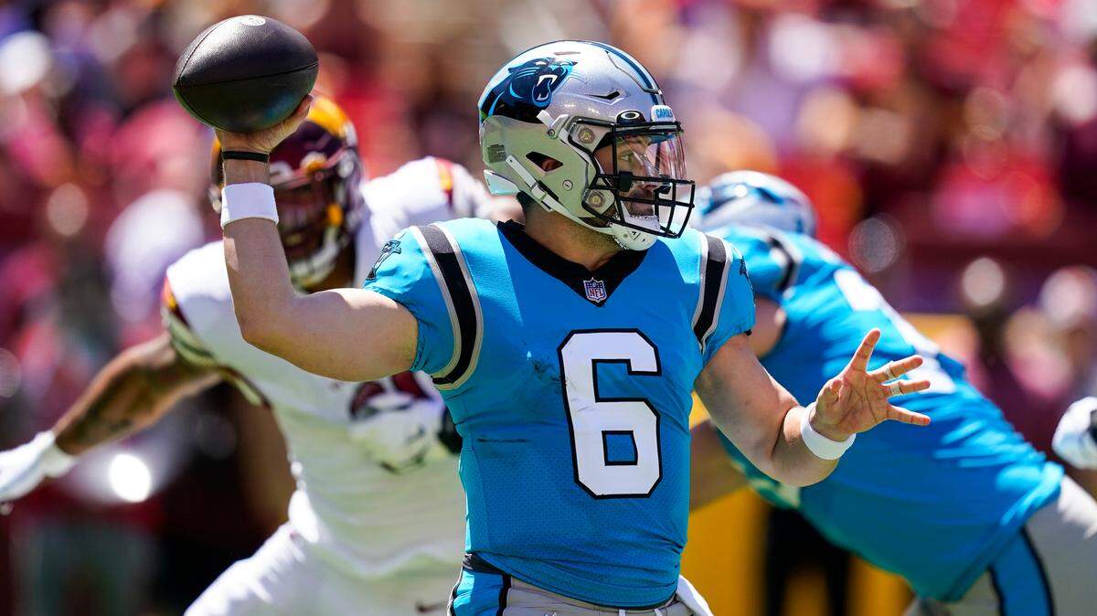 Carolina Panthers quarterback Baker Mayfield (6) throws a pass during the first half of a NFL preseason football game against the Washington Commanders, Saturday, Aug. 13, 2022, in Landover, Md. (AP Photo/Alex Brandon)
