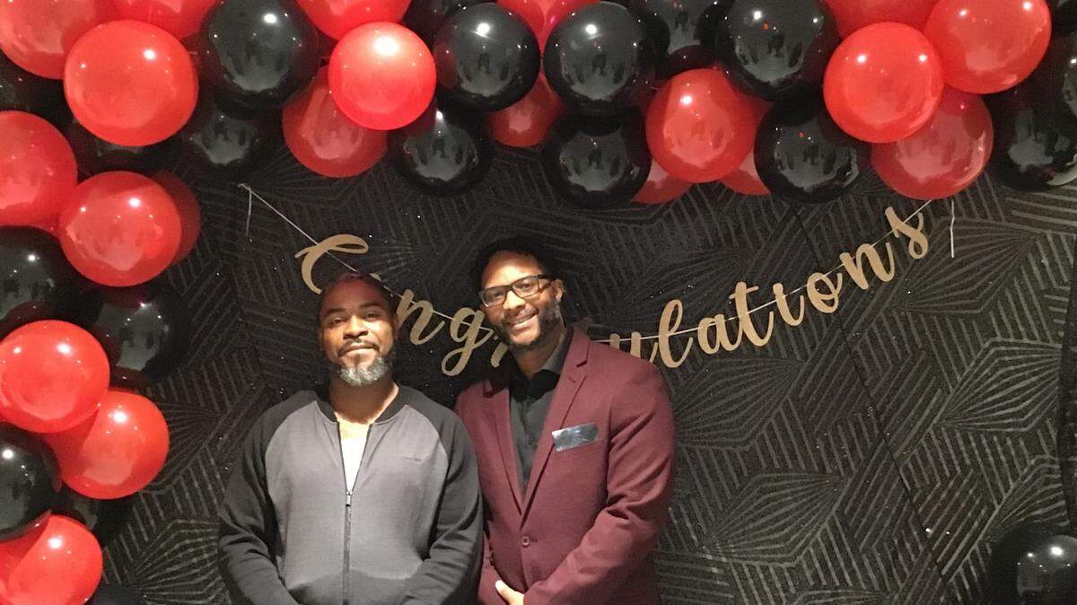 From left: Melvin Quick, a graduate of Freedom Fighting Missionaries’ Reentry program, shown with Kenny Robinson, executive director of Freedom Fighting Missionaries, at the nonprofit’s inaugural graduation. On Thursday, April 27, 2023, 15 participants graduated from the nonprofit’s reentry program with housing and employment.
