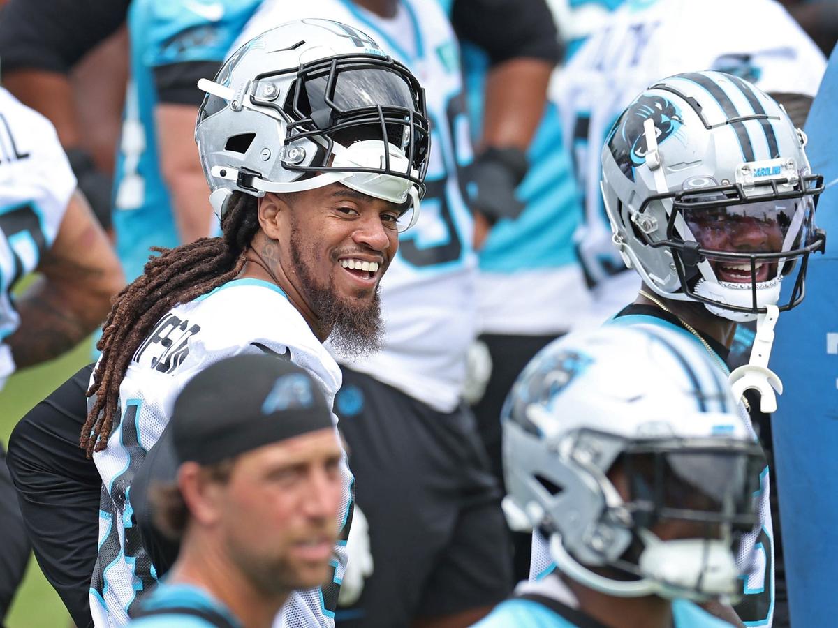 Carolina Panthers linebacker Shaq Thompson, left, stands along a sideline with his teammates during the team’s OTA practice on Tuesday, June 4, 2024.