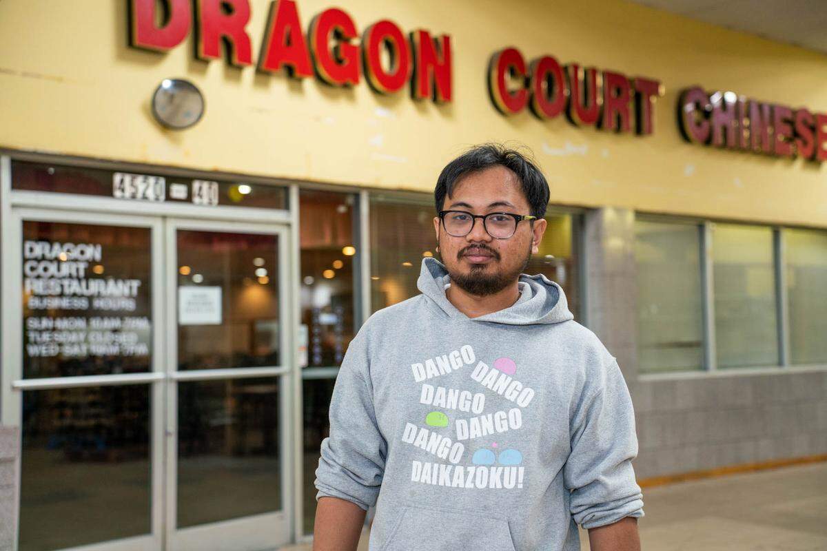 David Thatch stands outside of his family’s restaurant, Dragon Court.