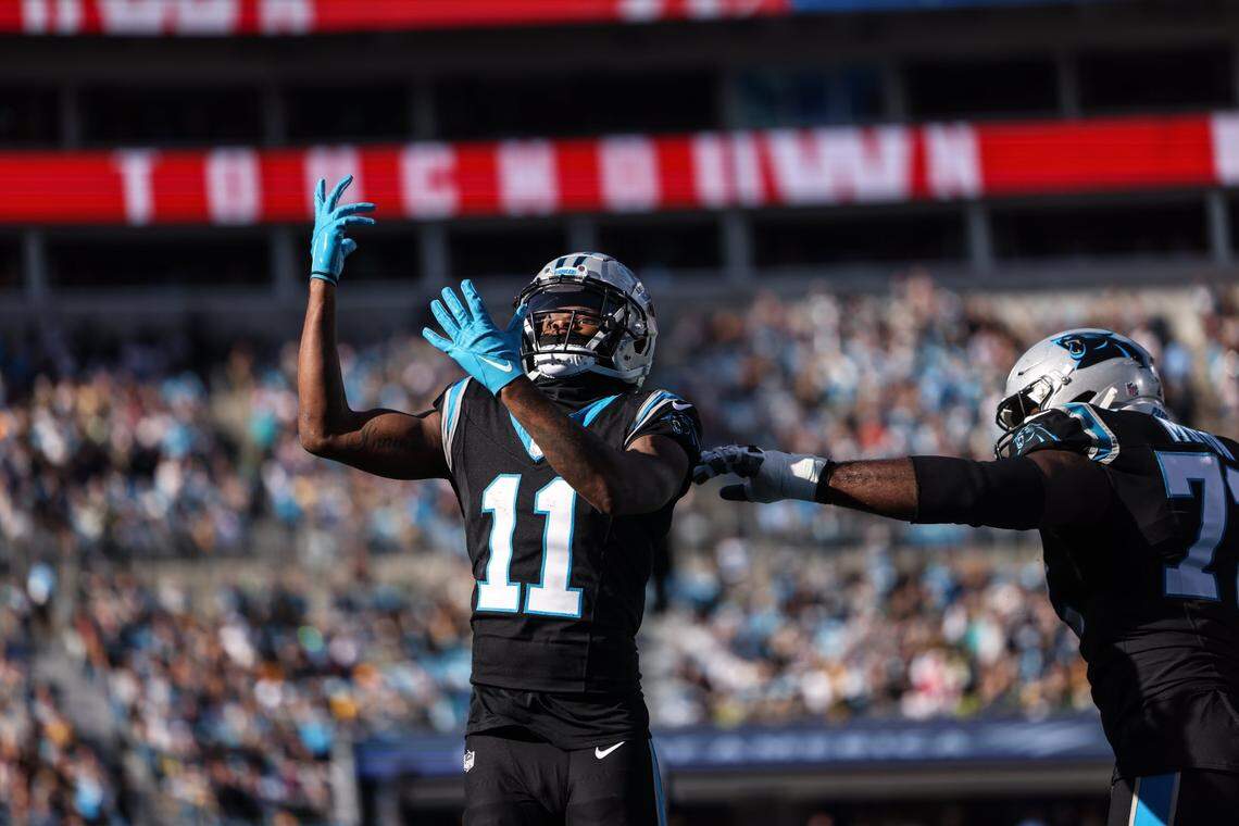 Carolina Panthers wide receiver Ihmir Smith-Marsette (11) celebrates a touchdown against the Green Bay Packers at the Bank of America Stadium in Charlotte, N.C., on Sunday, December 24, 2023.
